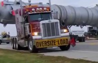 Big trucks hauling oversized load