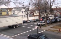 truck making tight turn on residental street