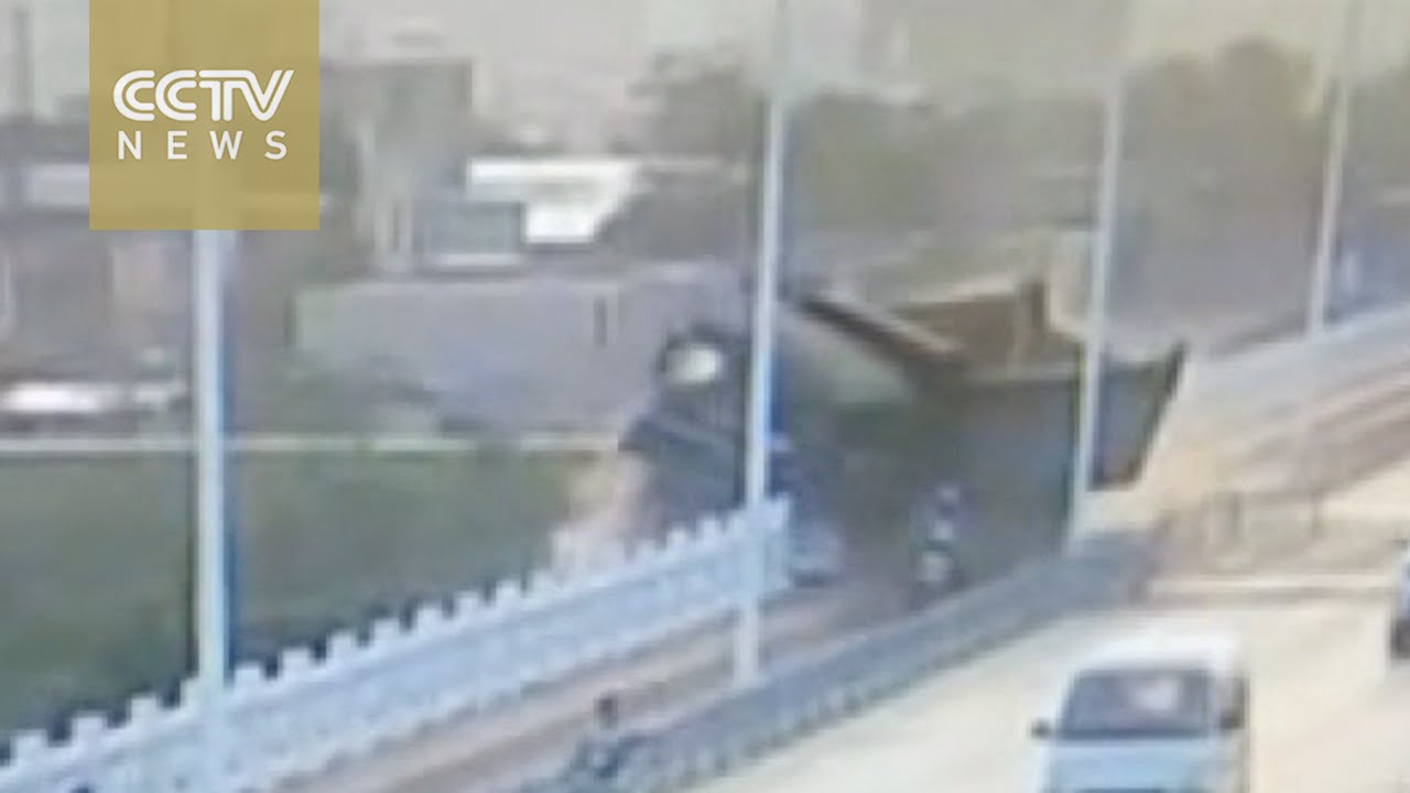 truck-falls-off-bridge-after-hit.jpg
