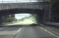 Truck smashes into overpass