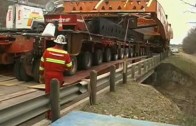 Big trucks hauling oversized load