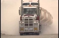 Big trucks hauling oversized load