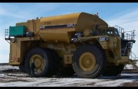 Big trucks hauling oversized load