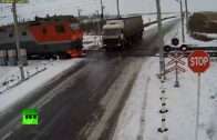 Two trains destroy a trapped truck on the tracks
