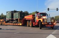 Big trucks hauling oversized load