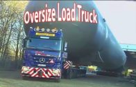 Big trucks hauling oversized load